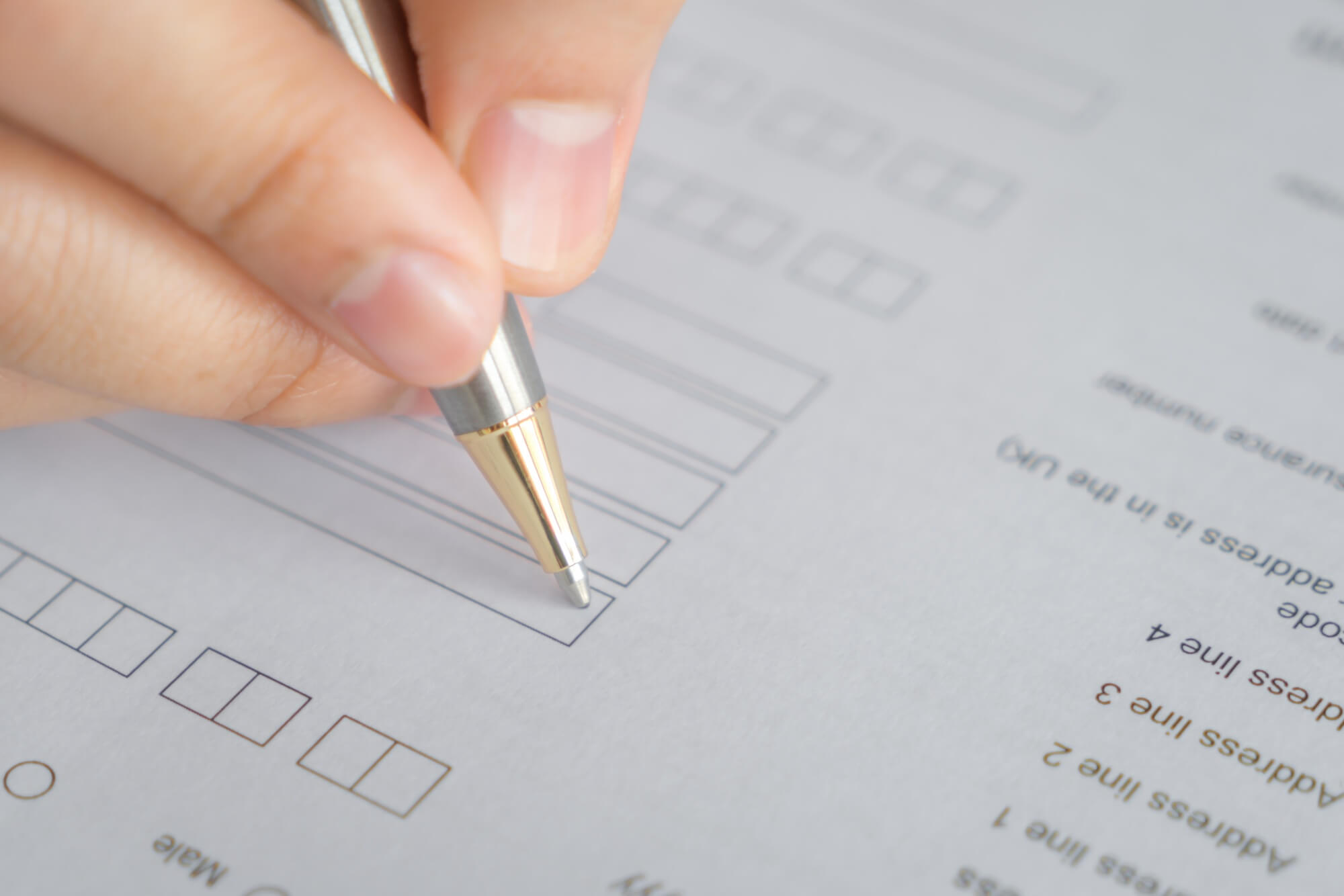 hand-with-pen-application-form