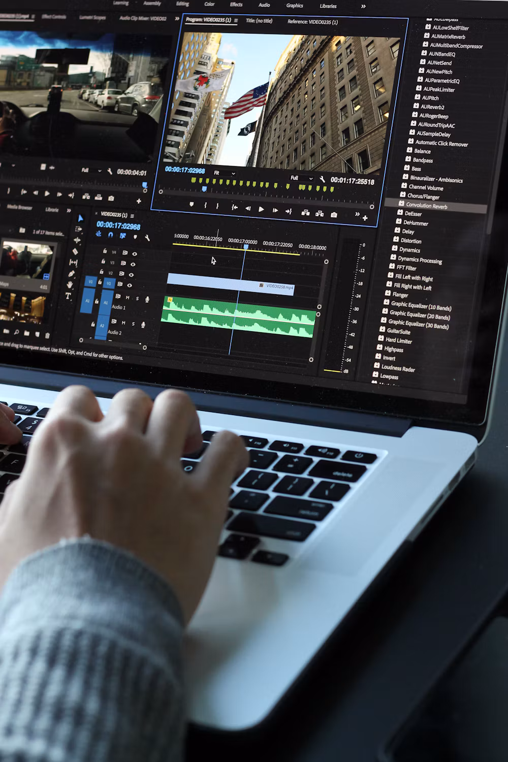 Student editing a video timeline on a laptop
